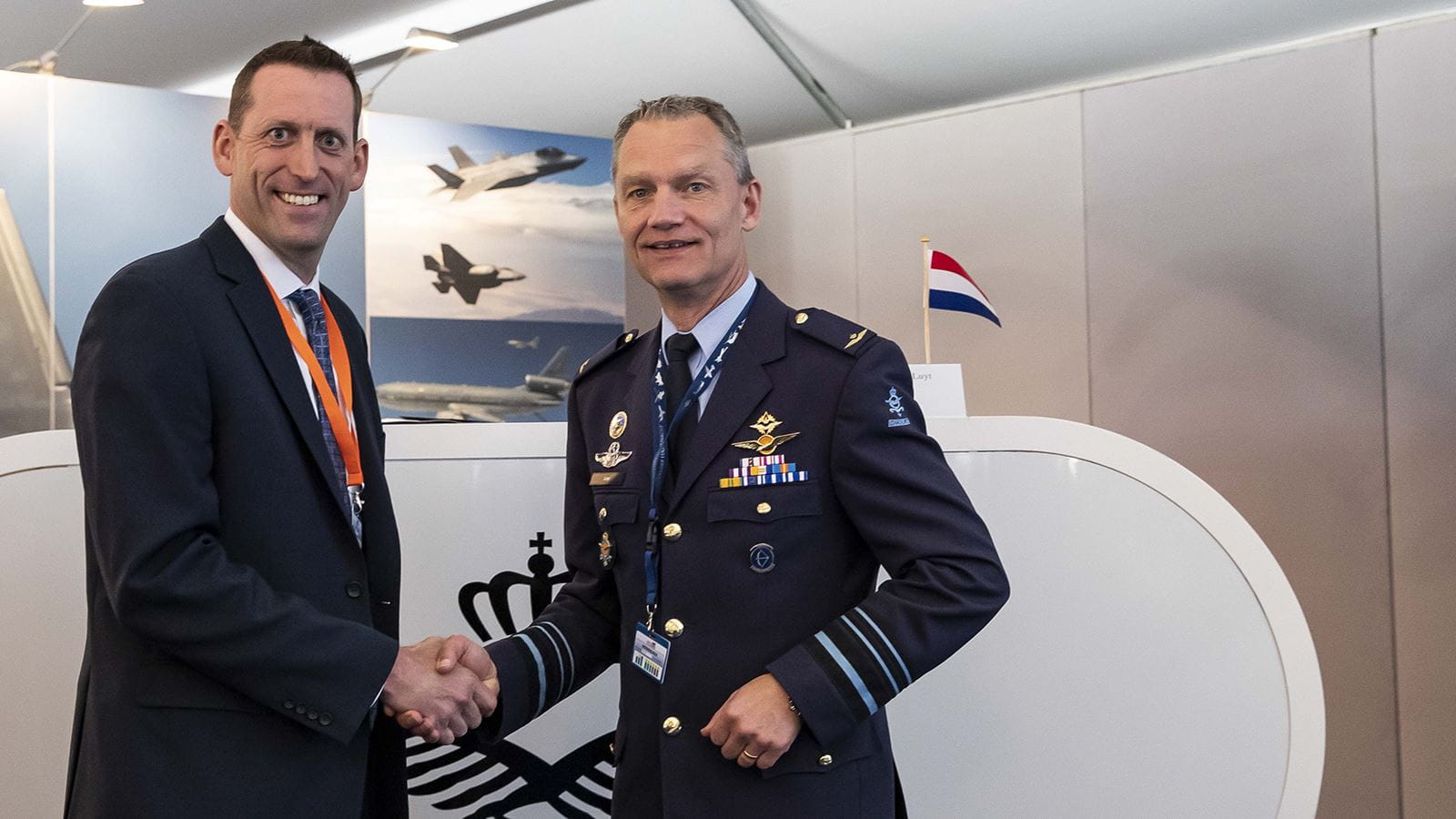 Craig Bries, vice president and general manager, Collins Aerospace shakes hands with Lt. Gen. J.D. Luyt, Commander of the Royal Netherlands Air Force