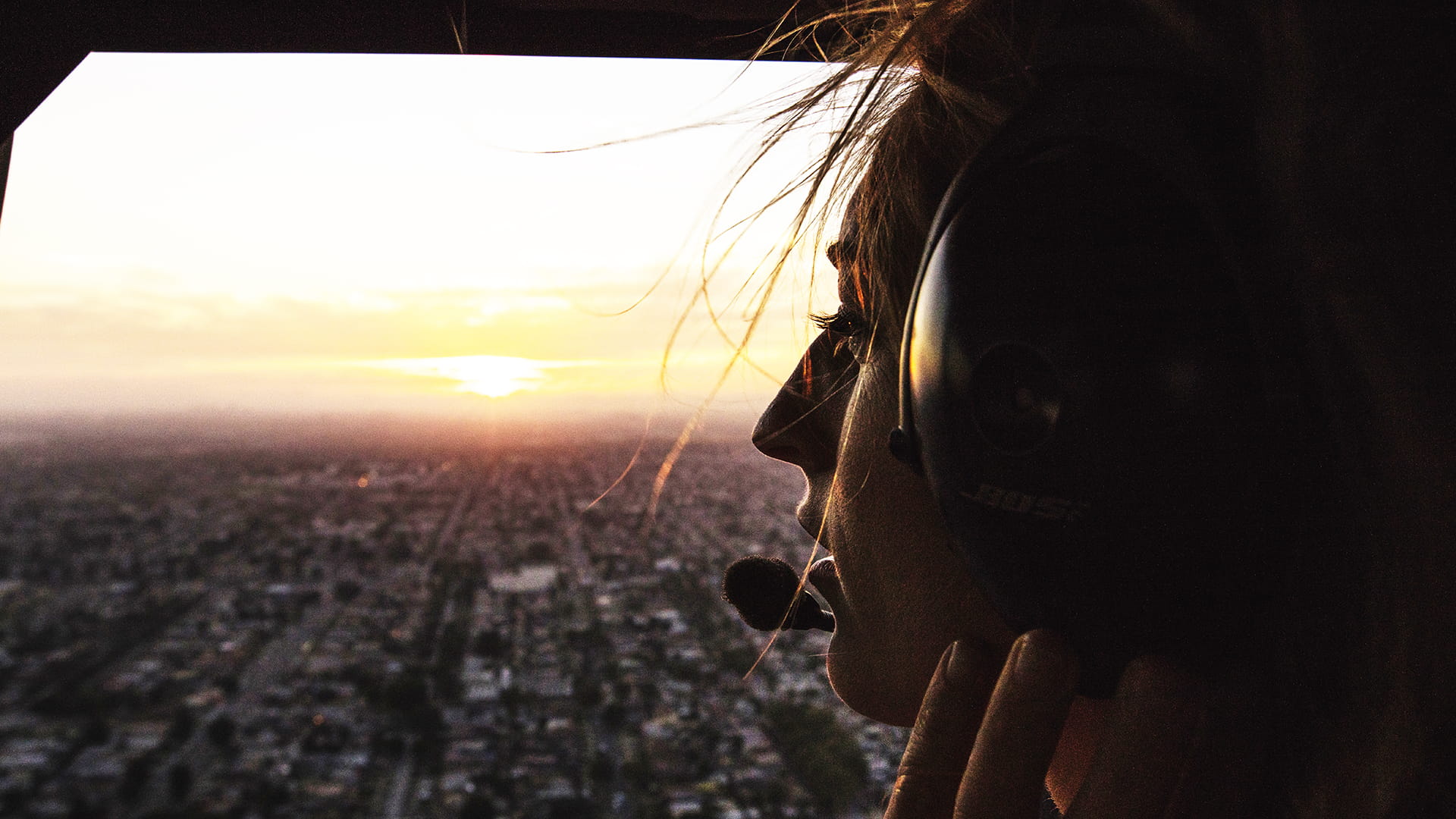 Woman looking out in an aircraft