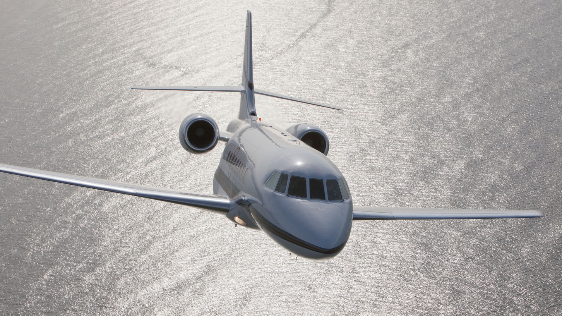 Dassault Falcon in flight over water