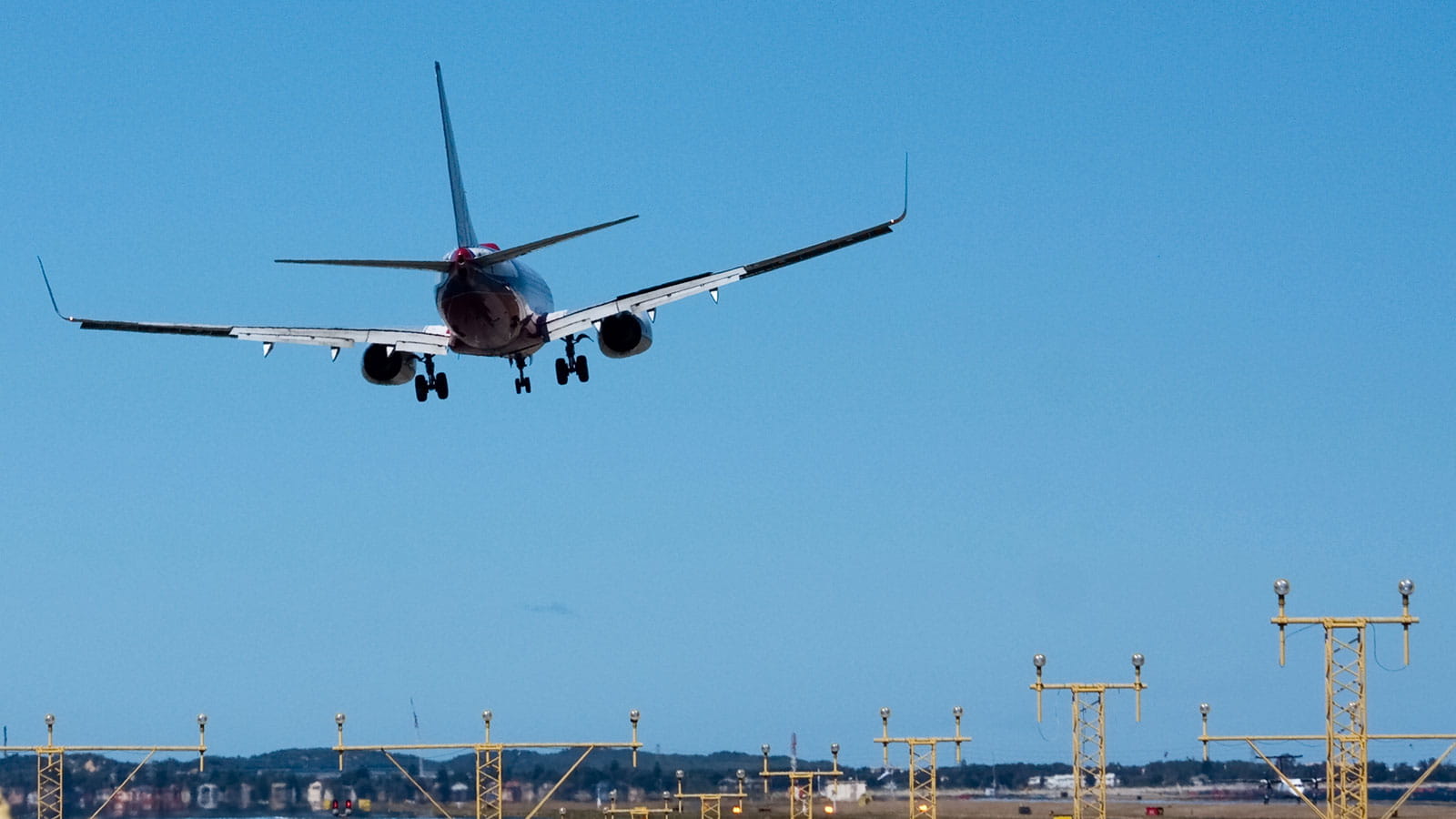 A Boeing 737 with wheels down for landing