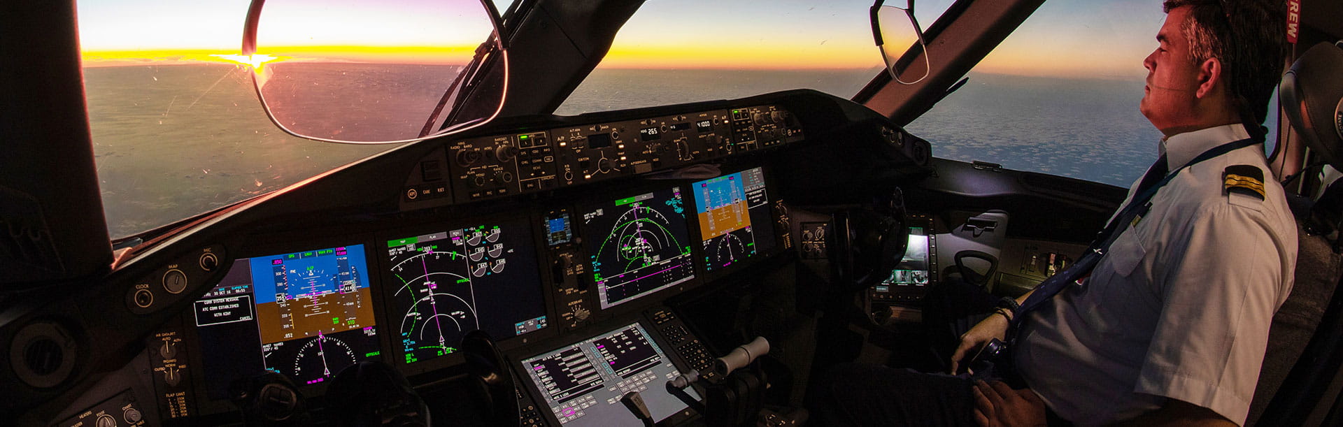 Airplane pilot in cockpit viewing horizon