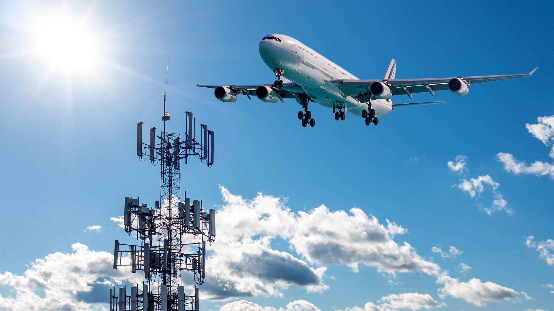 An airplane flying by a cell phone tower