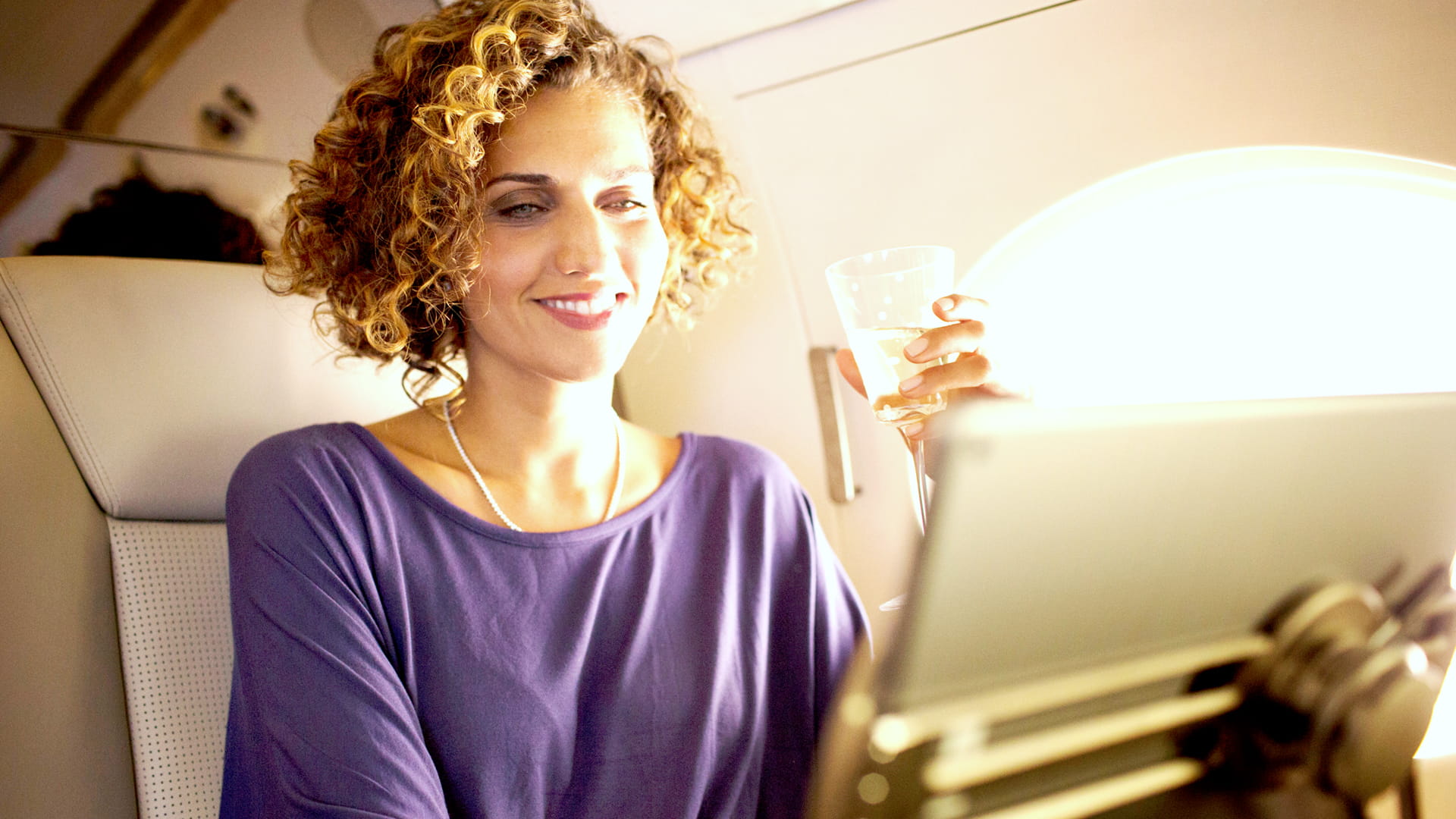 Woman using infotainment on jet