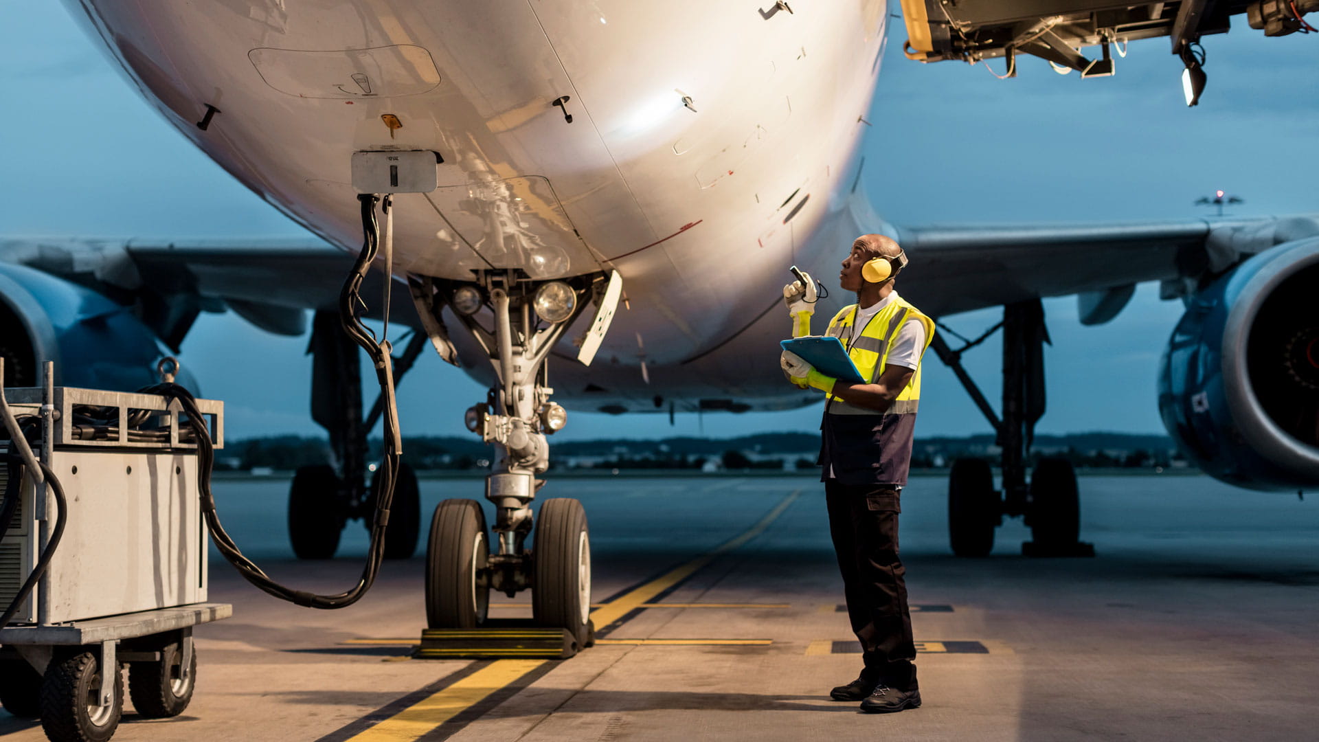 Airport crew inspecting plane