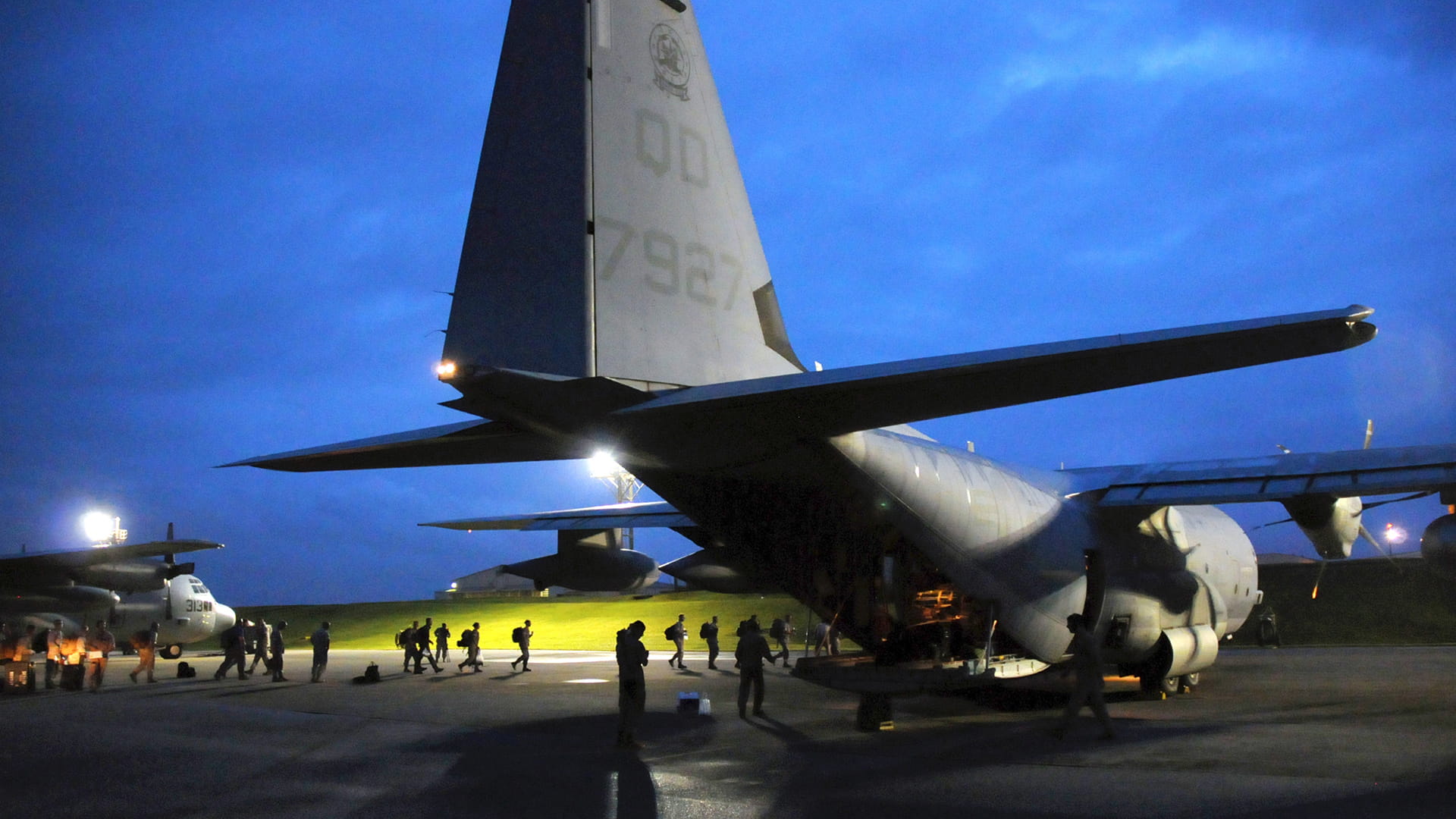 Military C-130 plane tail view