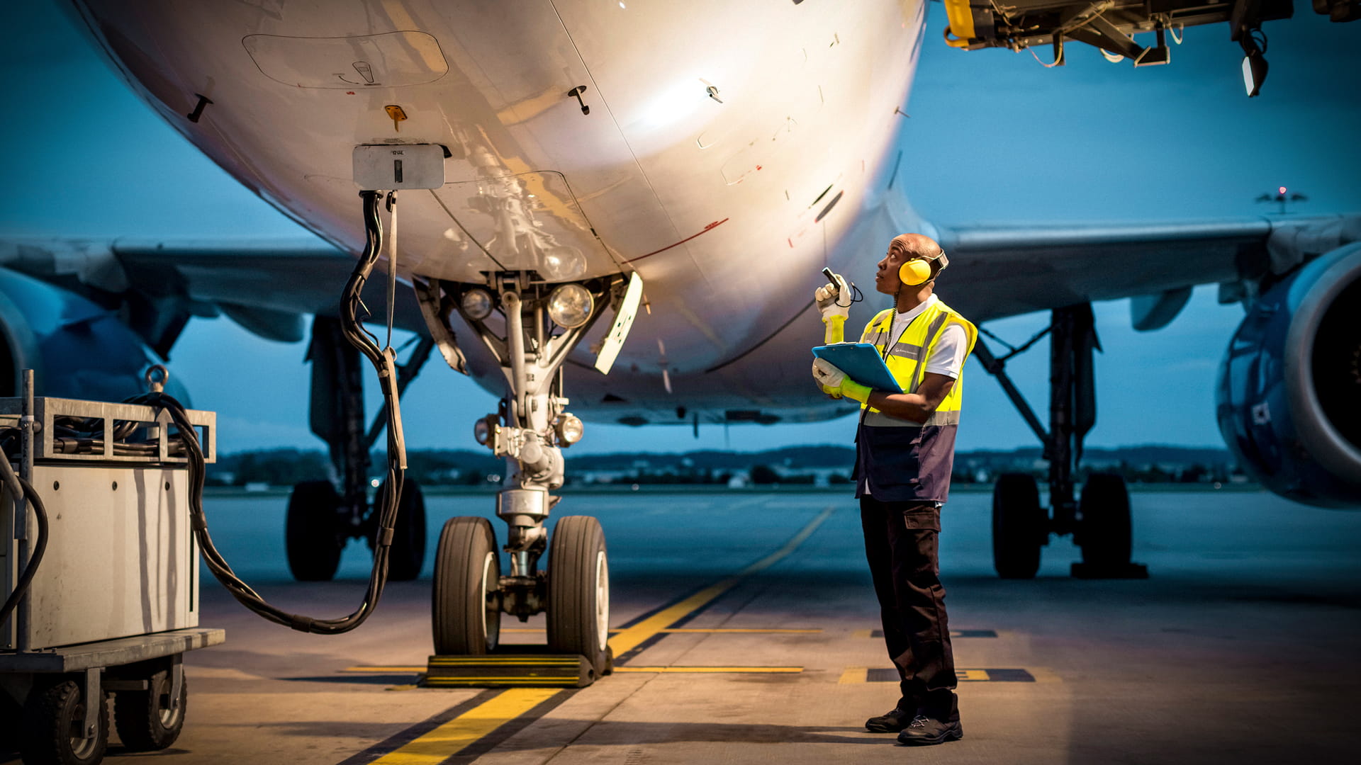 Maintenance technician performing diagnostics on an aircraft