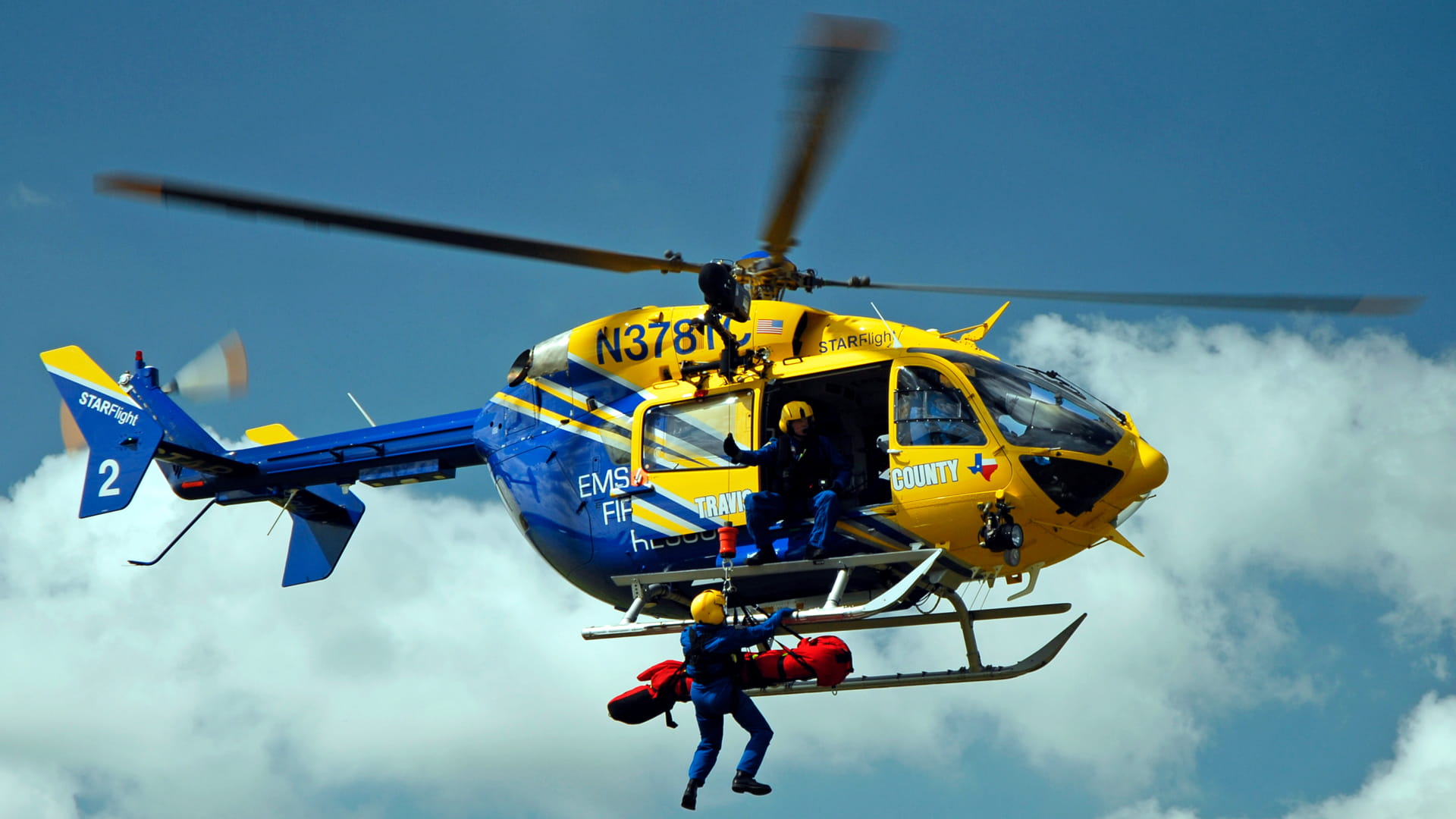 a person rescued by a helicopter