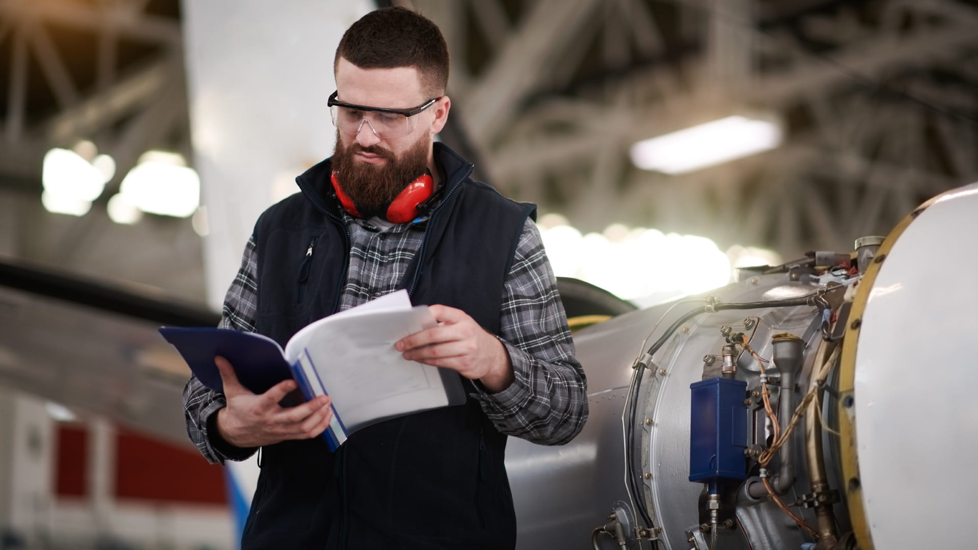 a technician reading a manual