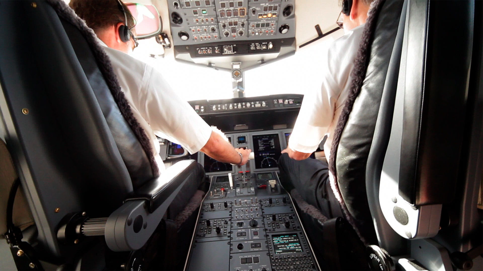 Pilot and copilot on the flight deck