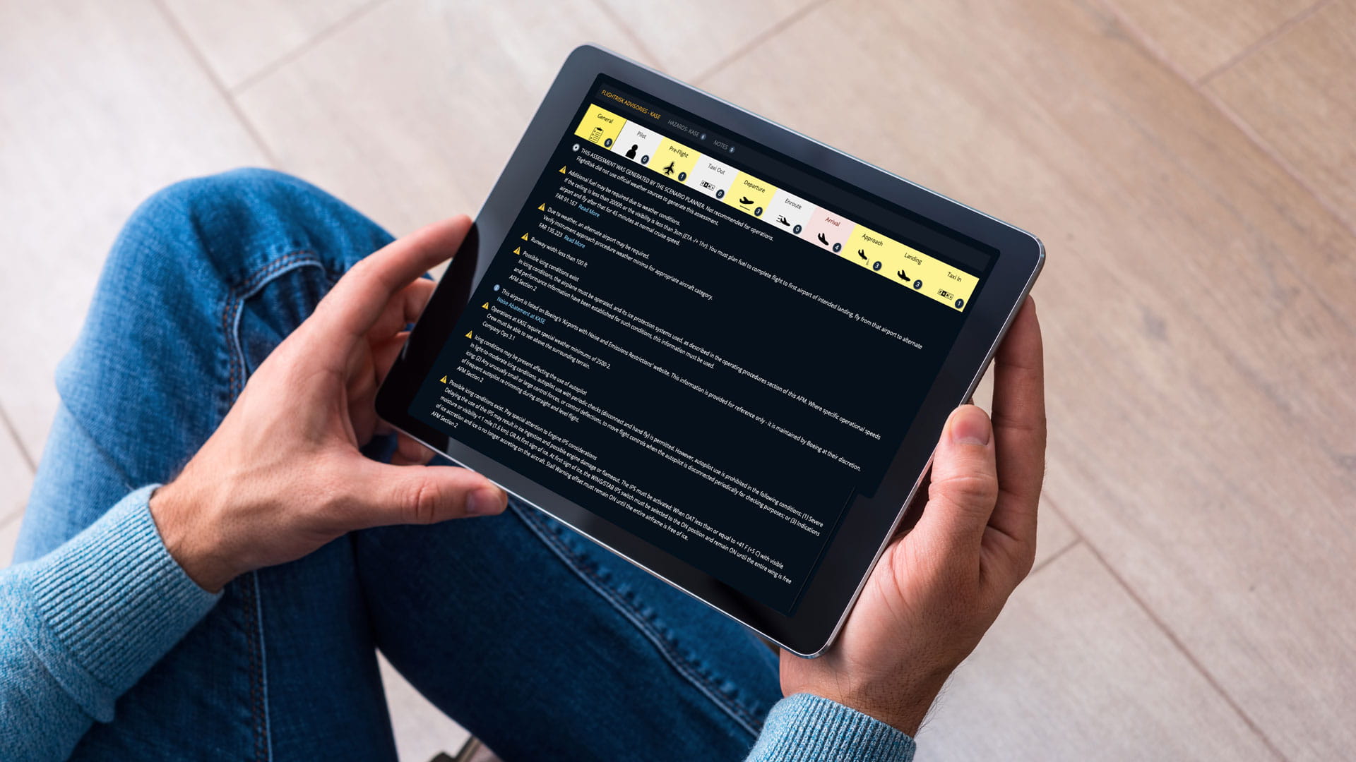 Person viewing the Collins FlightRisk® app on a tablet