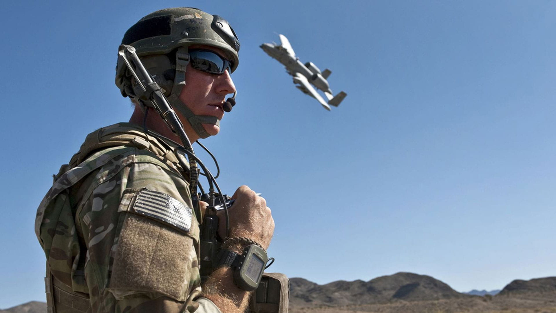 A soldier operates a drone