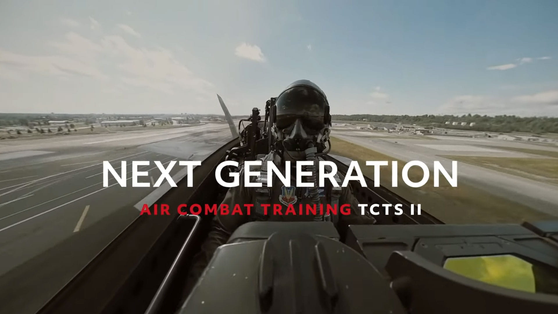 Fighter pilot in jet with the text 'Next Generation Air Combat Training TCTS II' is overlaid