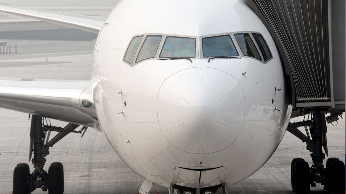 Airplane parked at a jet bridge