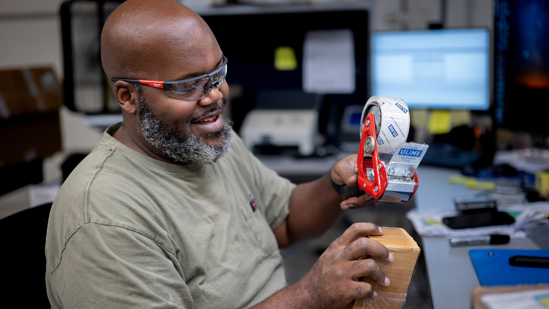 Worker using packing tape