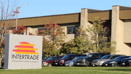 An office building with a monument sign