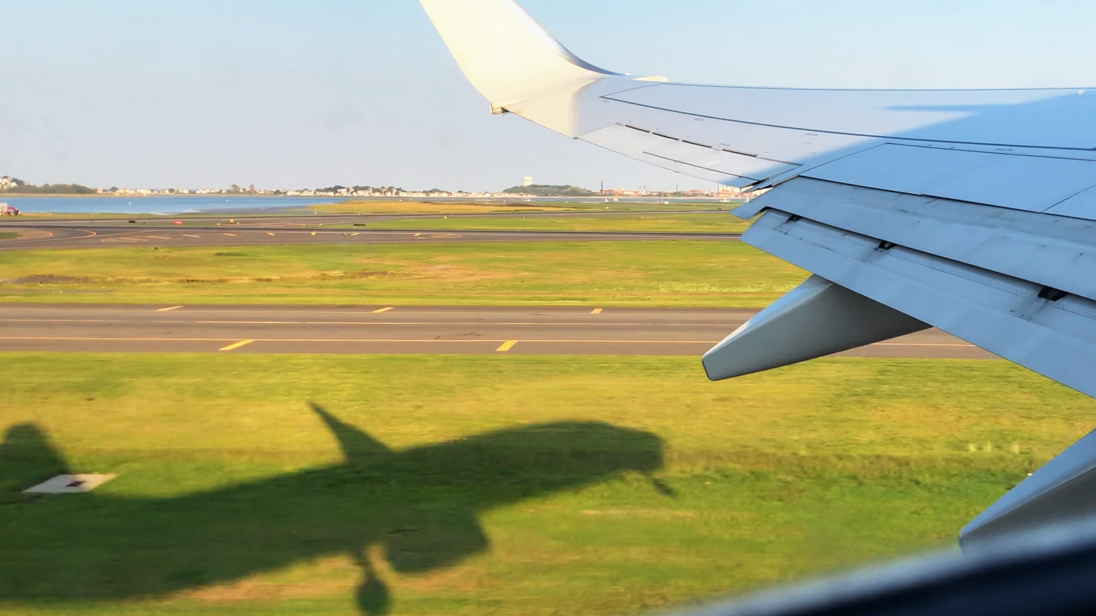 plane taking off against green backdrop