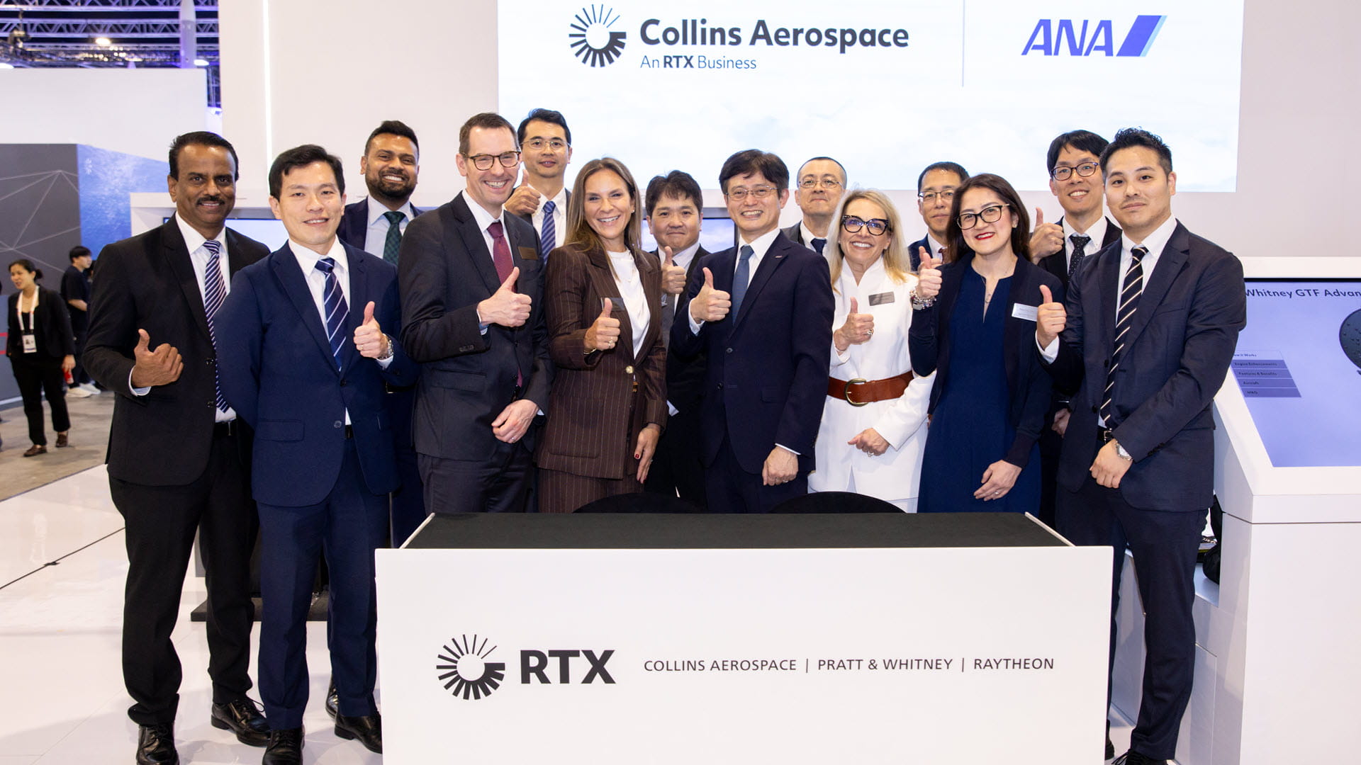 Men and women at a signing ceremony