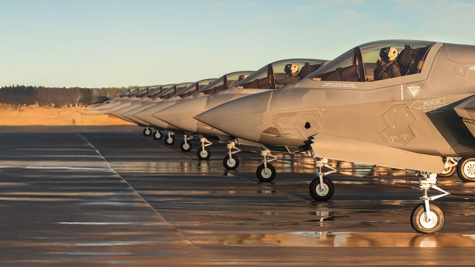 F-35 jets parked on a runway