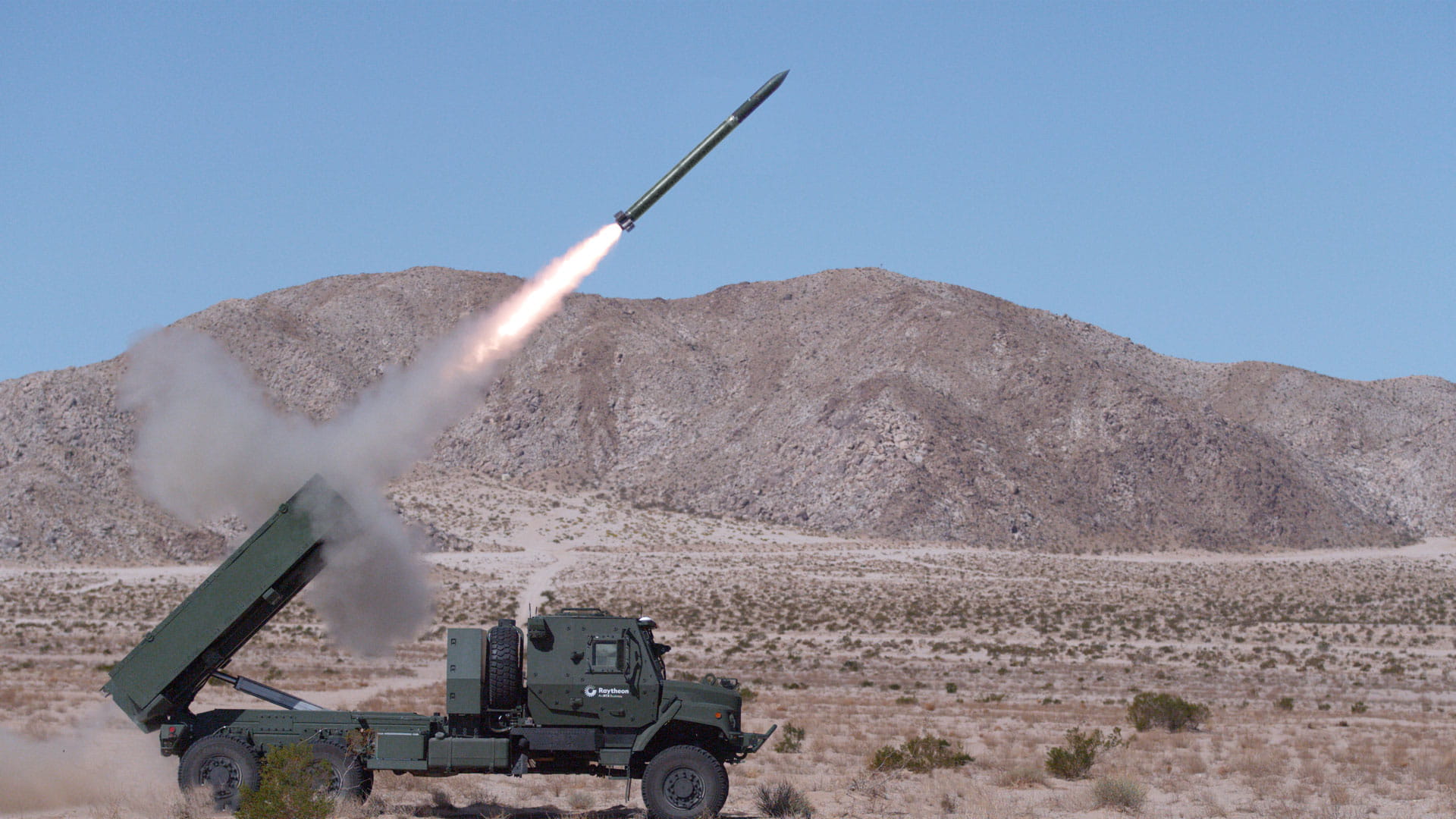 A missile launching from a ground vehicle