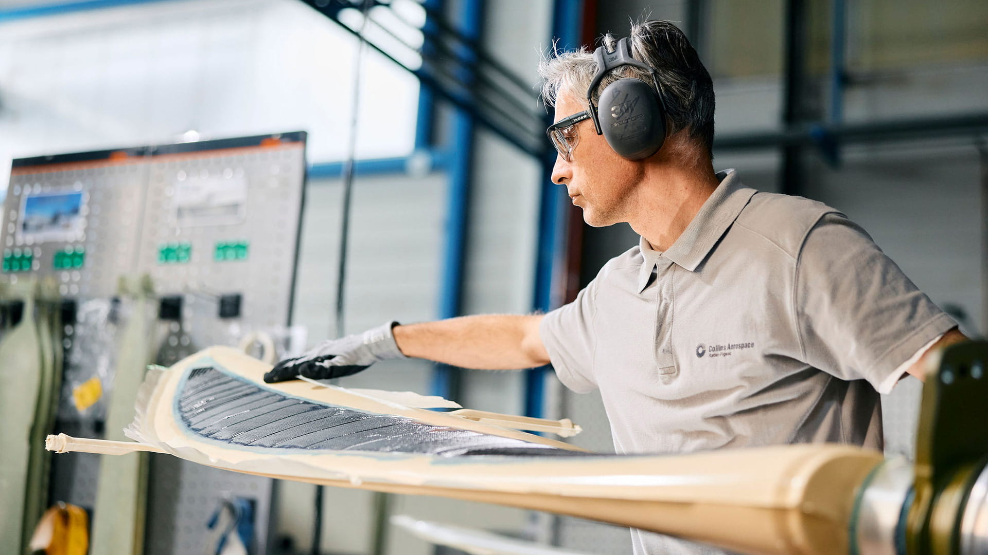 A technician working on an aircraft component