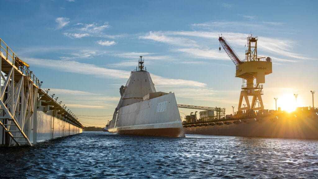 A Zumwalt-class destroyer at sunset