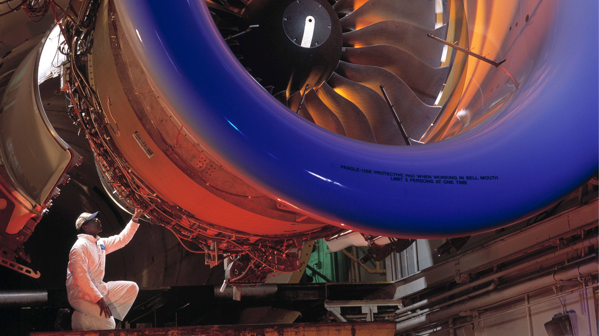 A technician working on a GP7000 engine