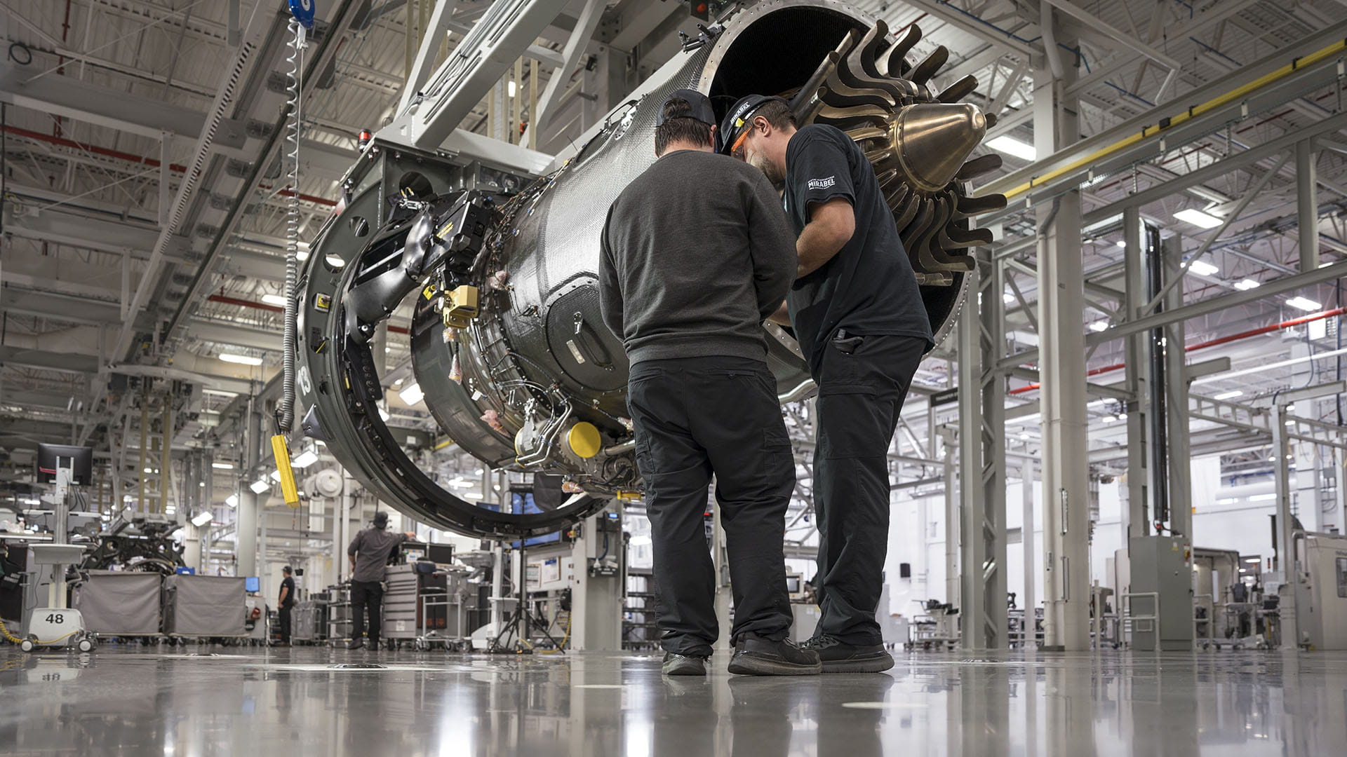 PW800 being assembled by two workers