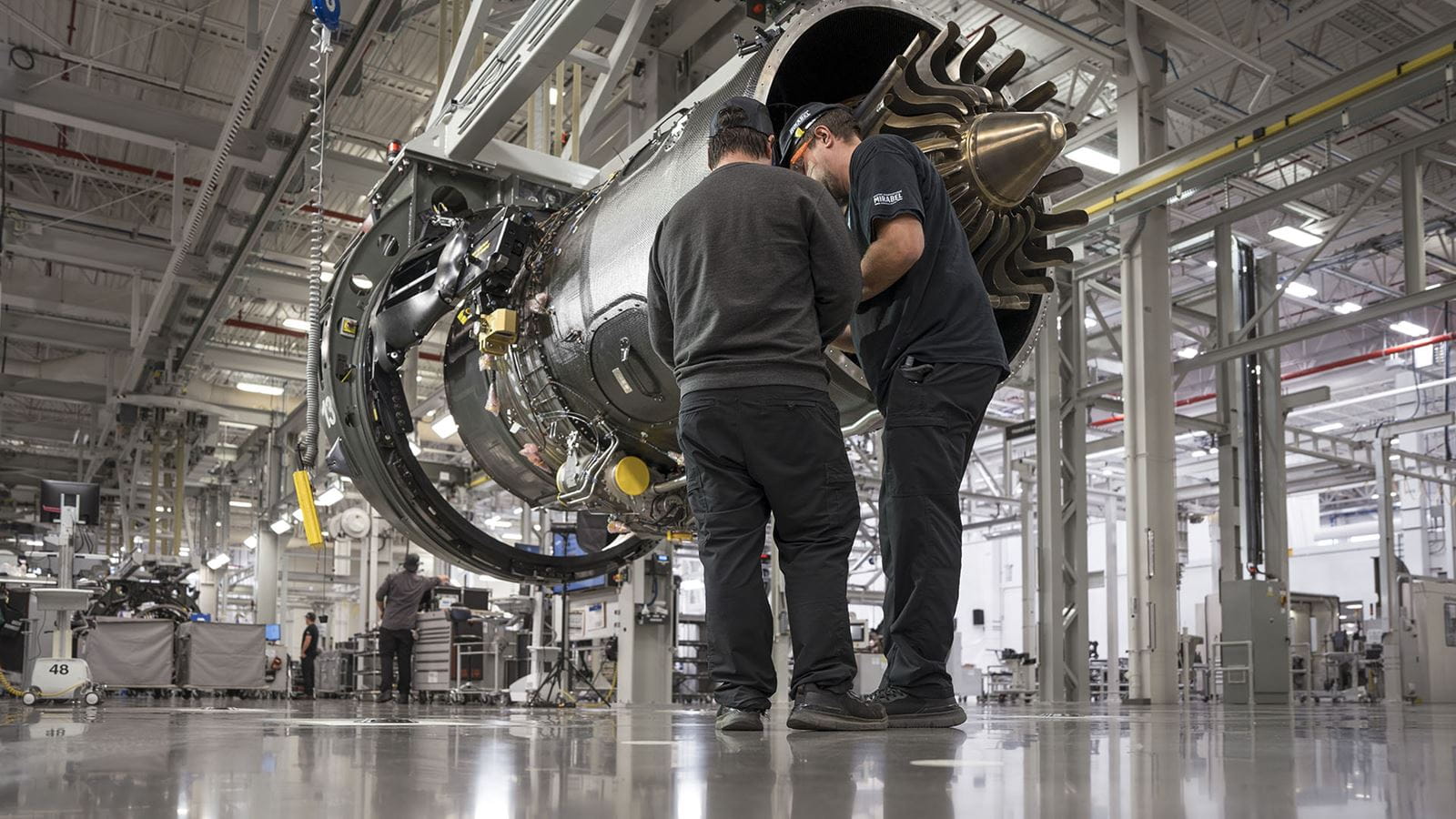 PW800 being assembled by two workers