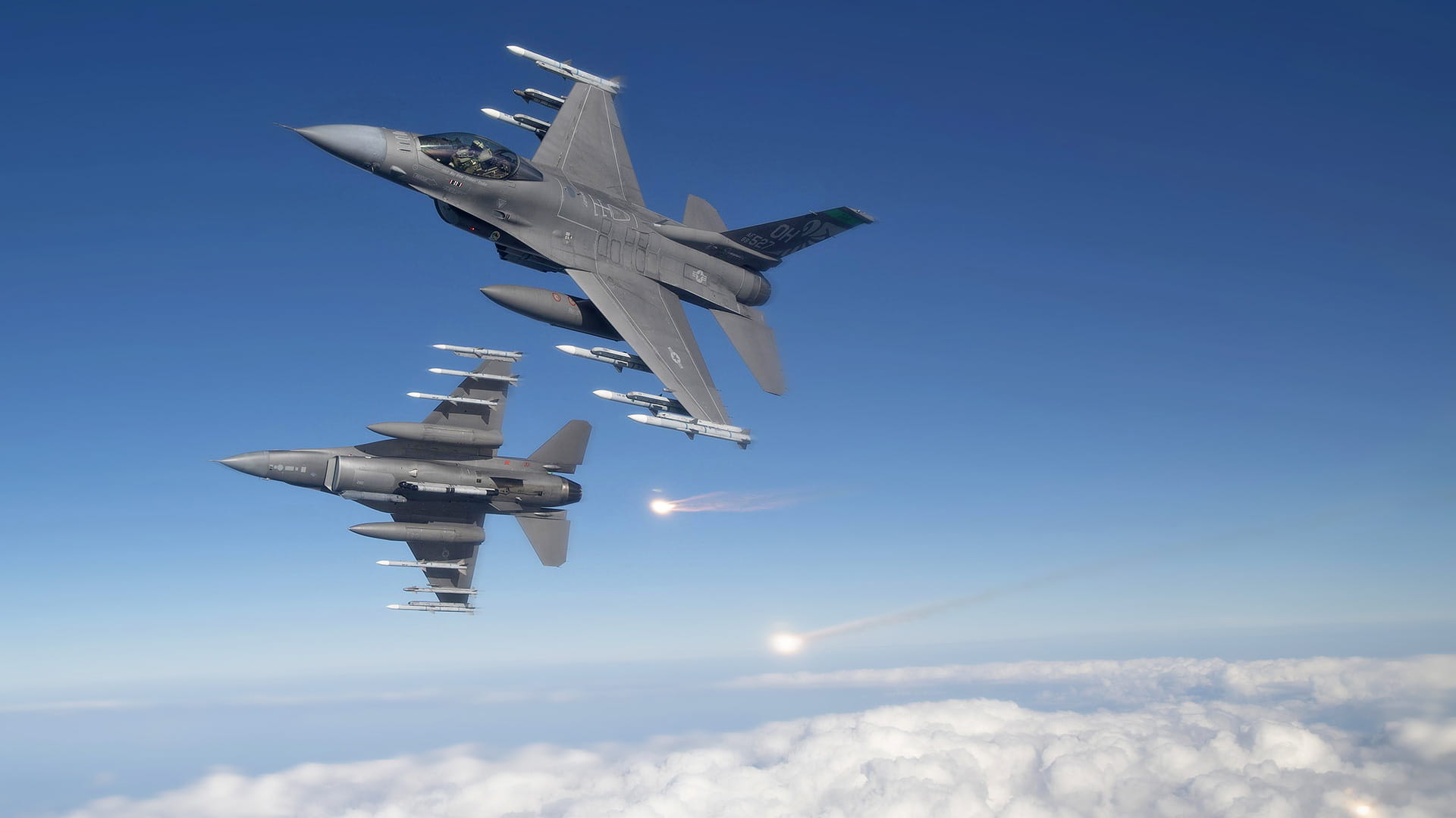 Fighter jets firing AIM-9X missiles