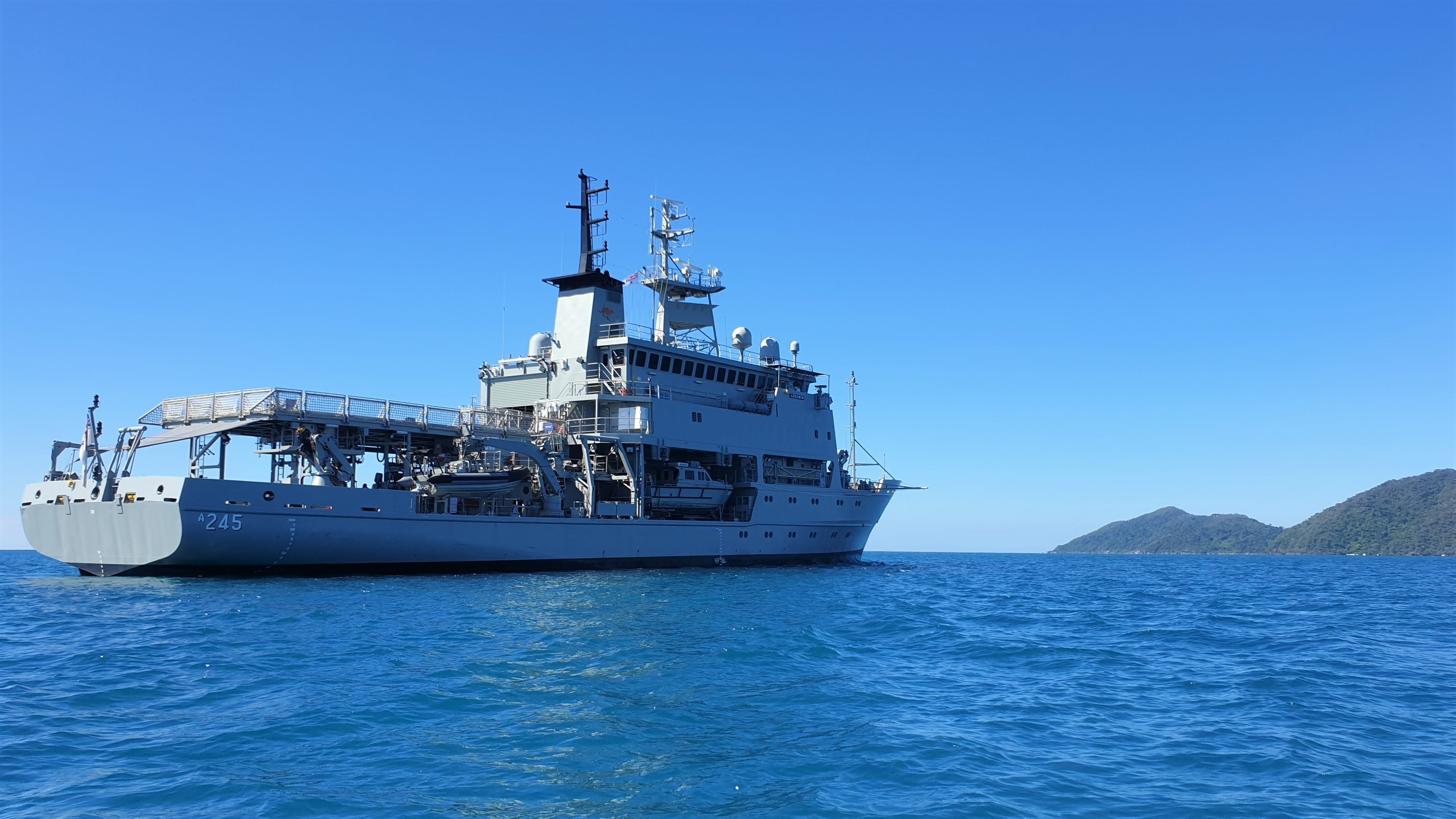 HMAS Leeuwin surveys Mission Beach off the coast of Queensland