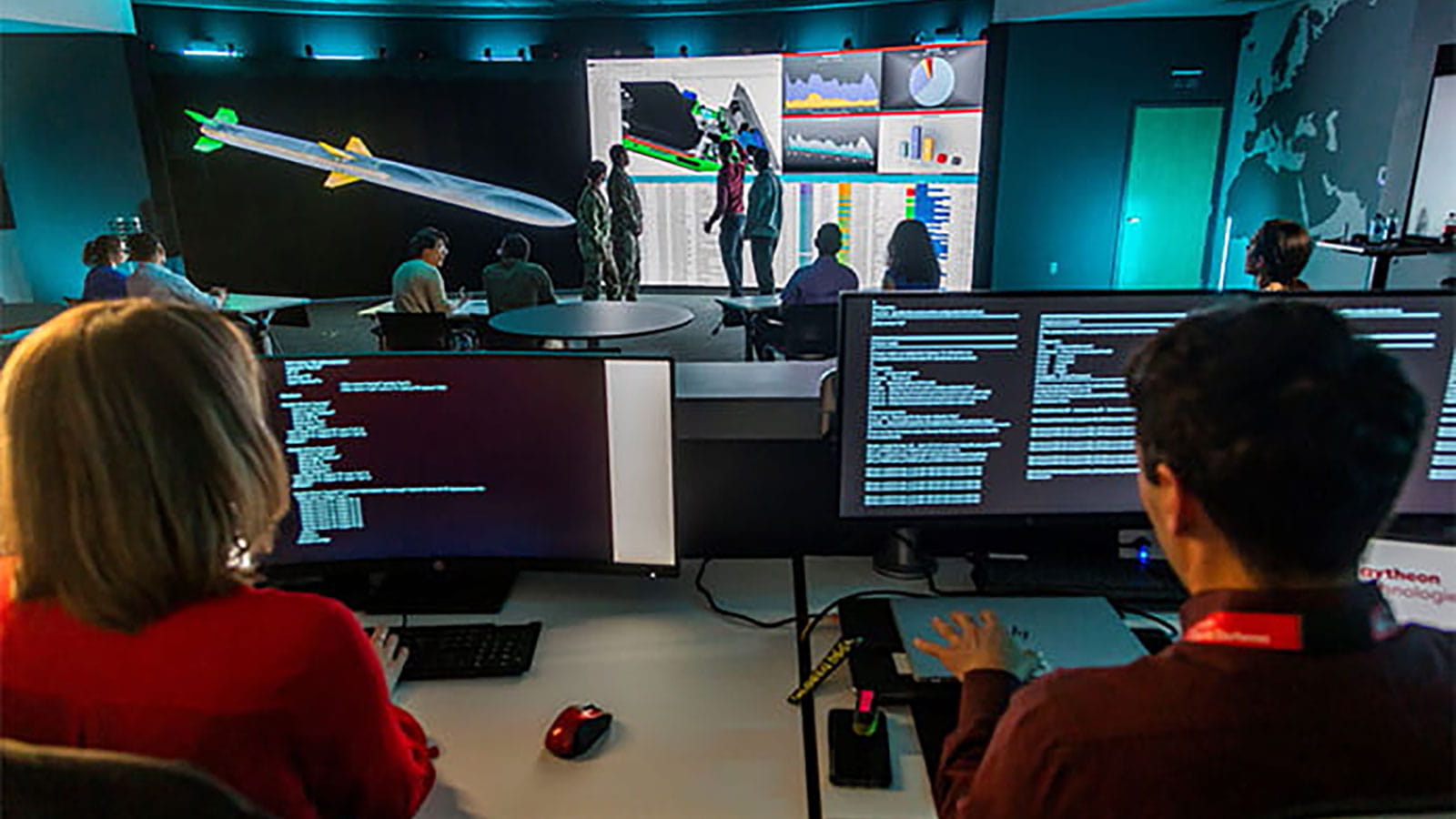 software engineers sitting in front of computer monitors