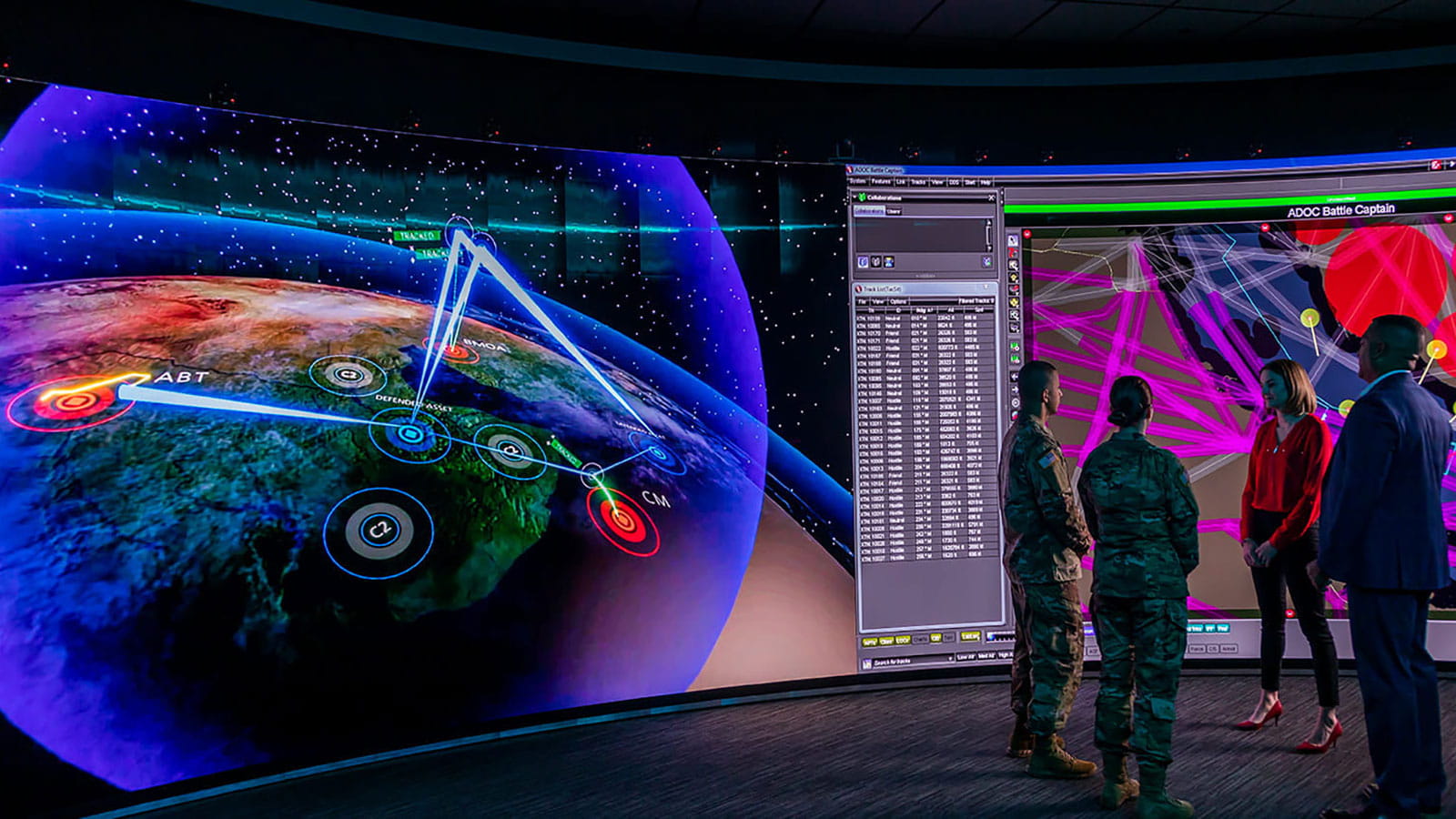 employees in uniform standing in front of projector screen