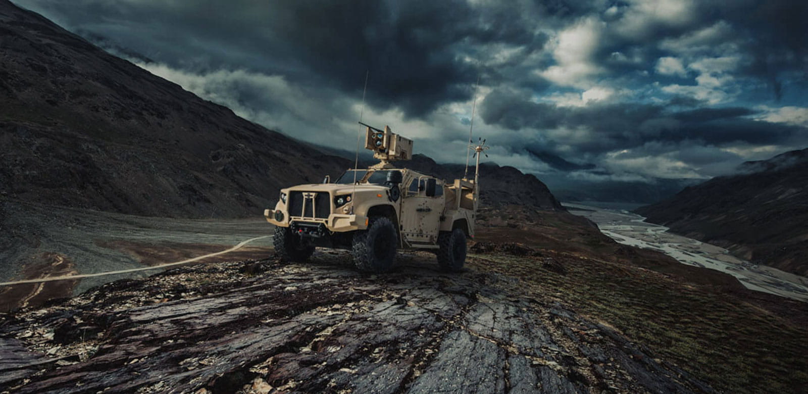 a military vehicle in a mountain terrain
