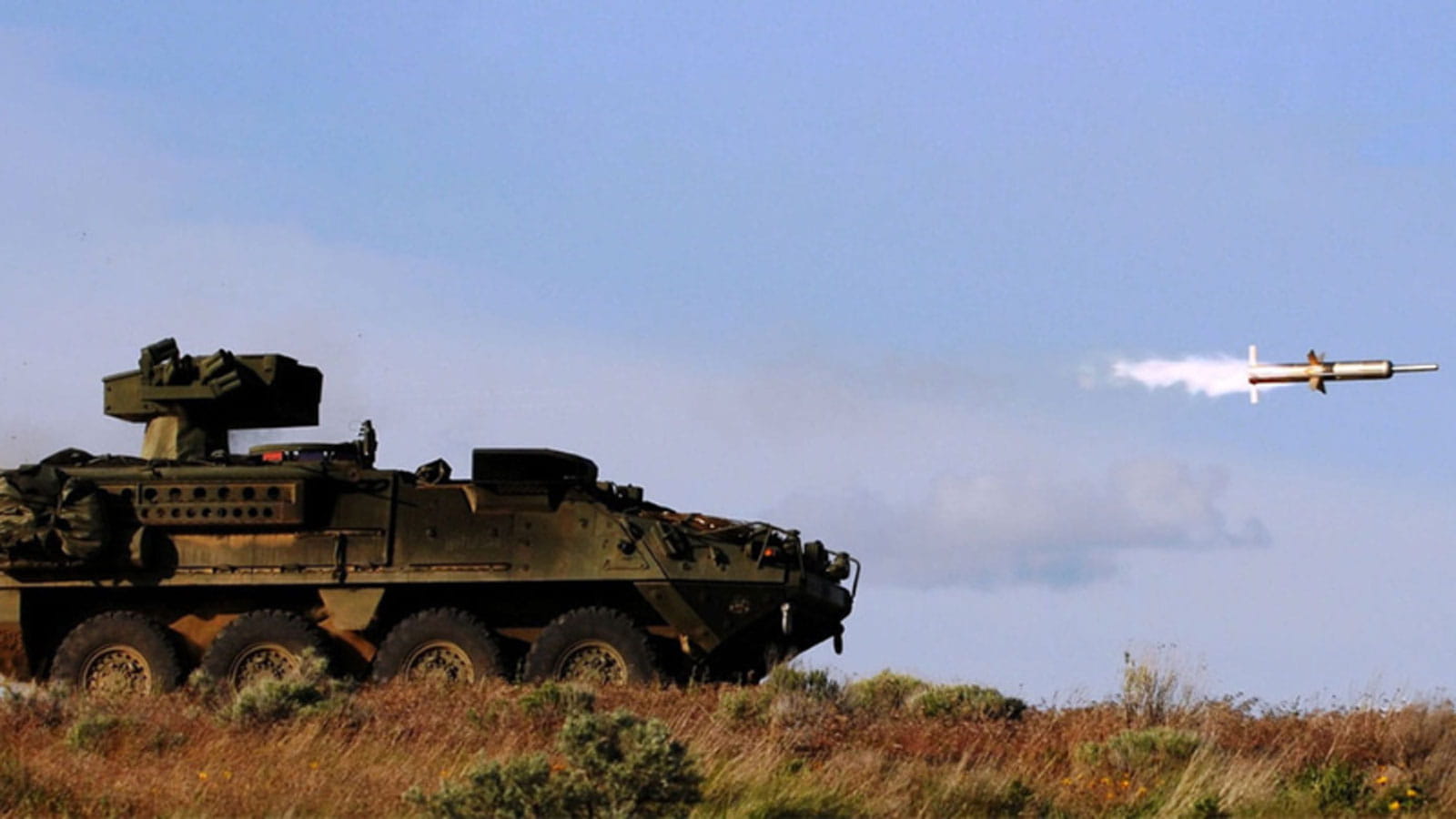 A battle tank firing missile