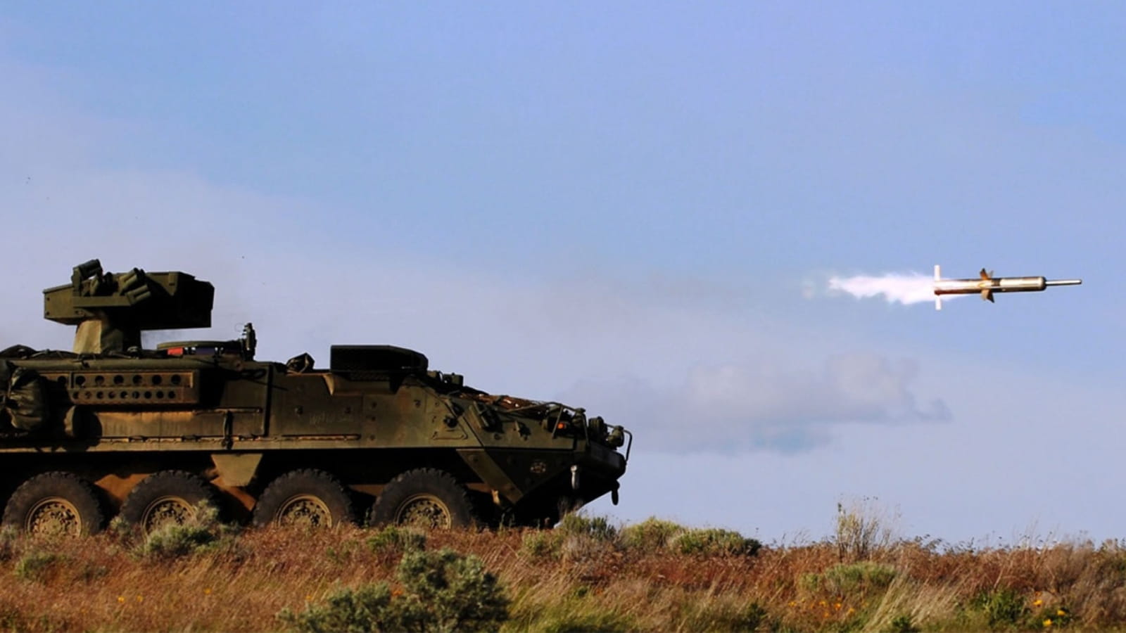 Tank firing Tube-launched, optically-tracked, wireless-guided (TOW) weapon system