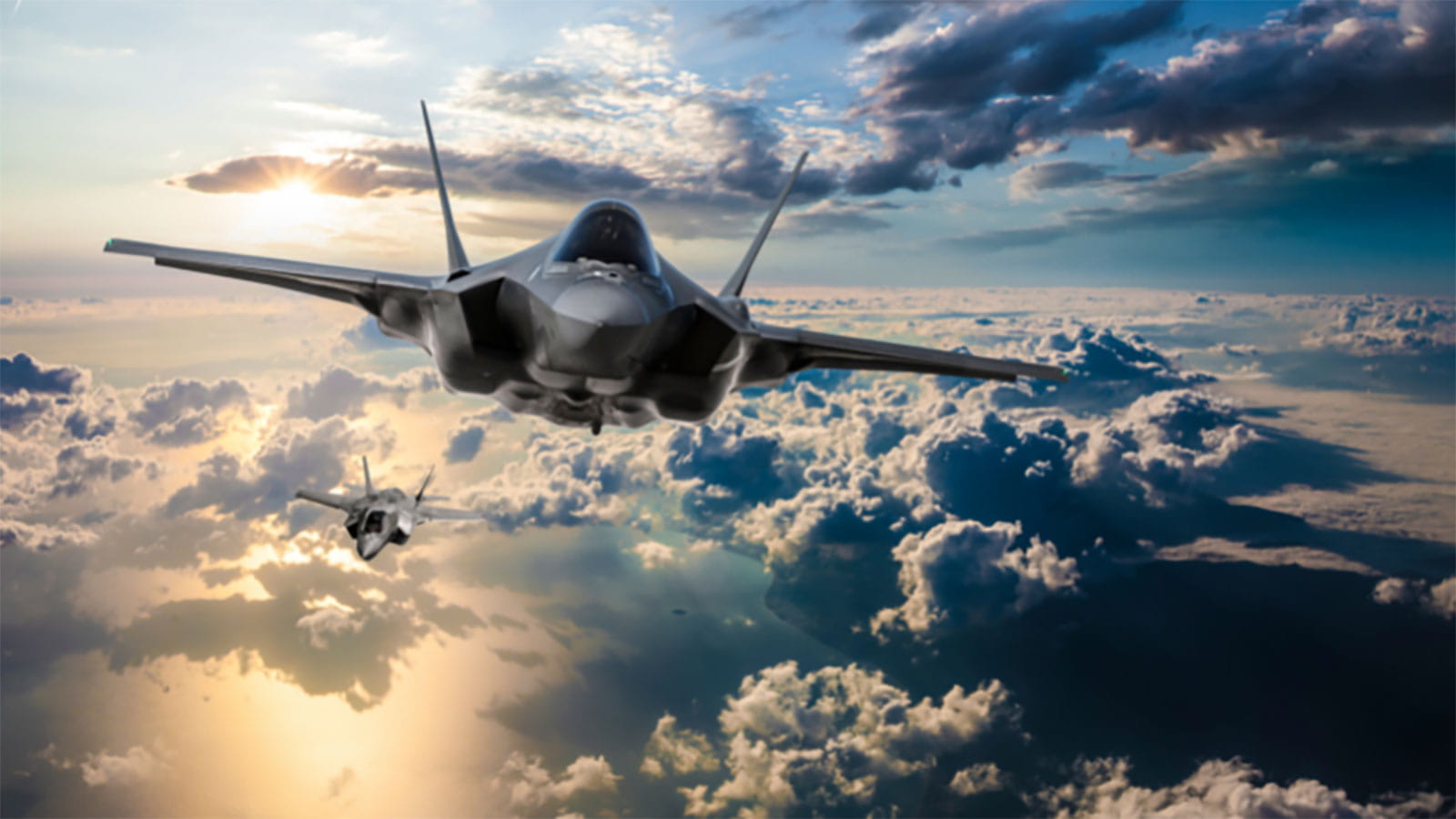a fighter aircraft flying through the clouds