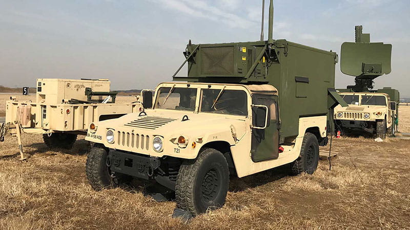 a beige military humvee