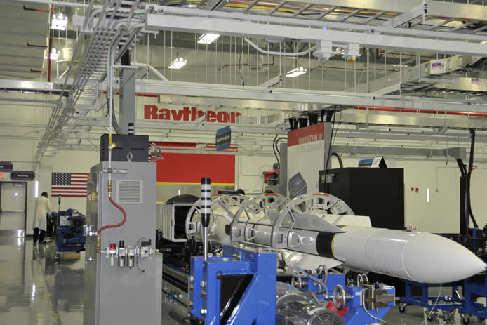 A Standard Missile-6 is loaded into a specialized container at the Raytheon Redstone Missile Integration Facility for delivery to the U.S. Navy.