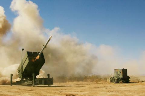 A National Advanced Surface to Air Missile System canister fires an AMRAAM missile.