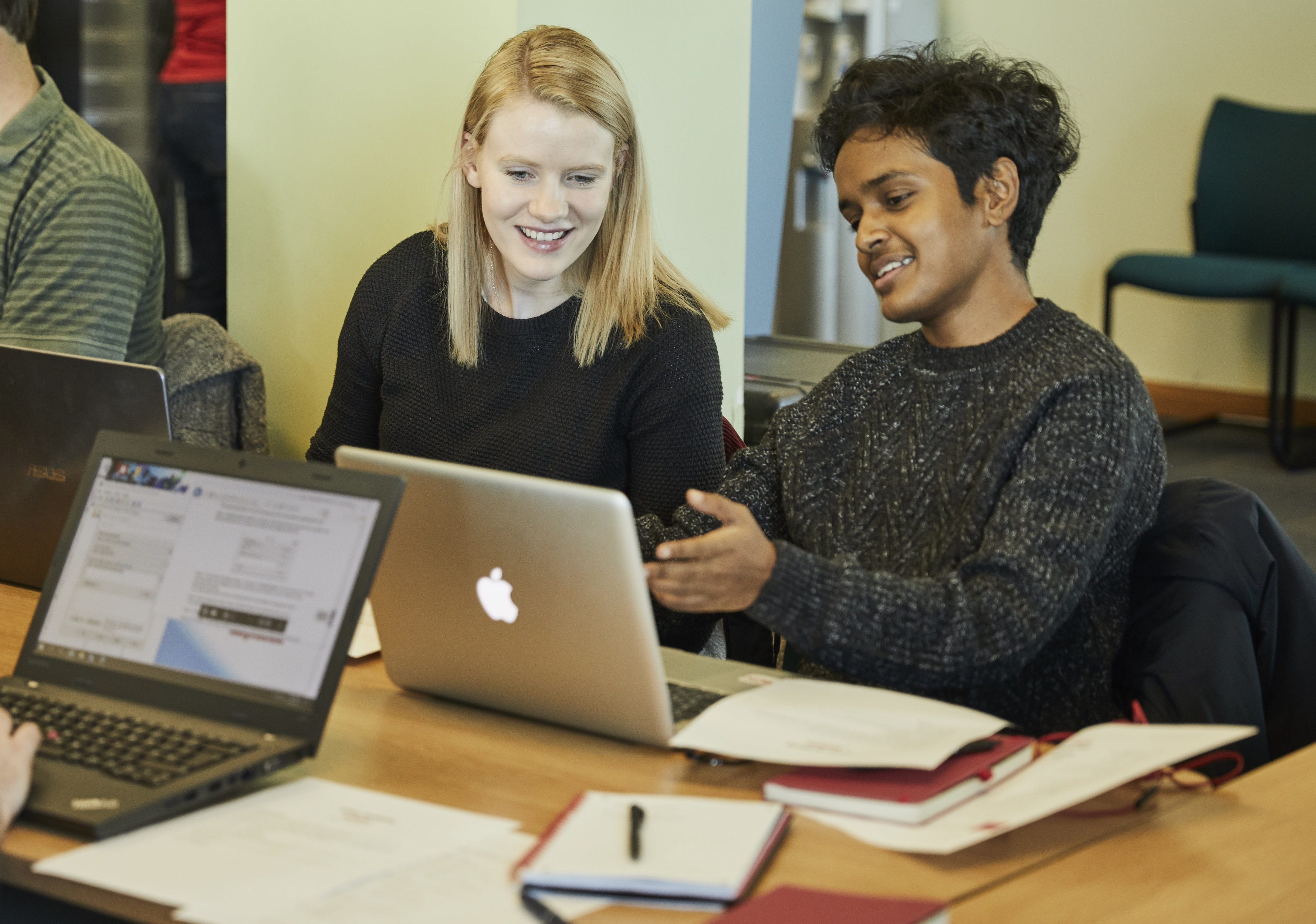 Two Lancaster University students work through the labs for the advanced cyber training module.