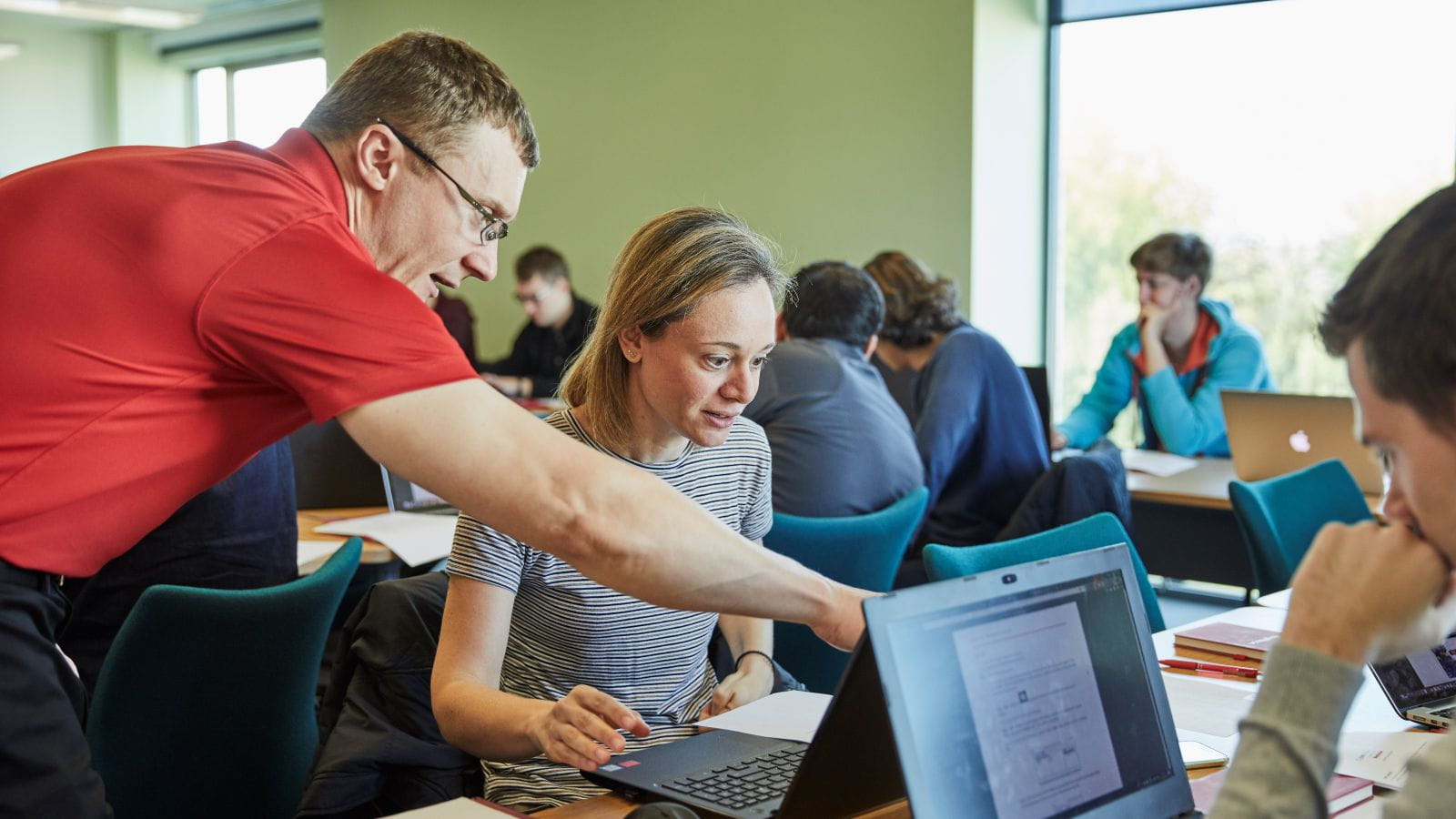 Dr. Keith Harrison shows a Lancaster University student additional steps needed to detect and remove malware from a system.