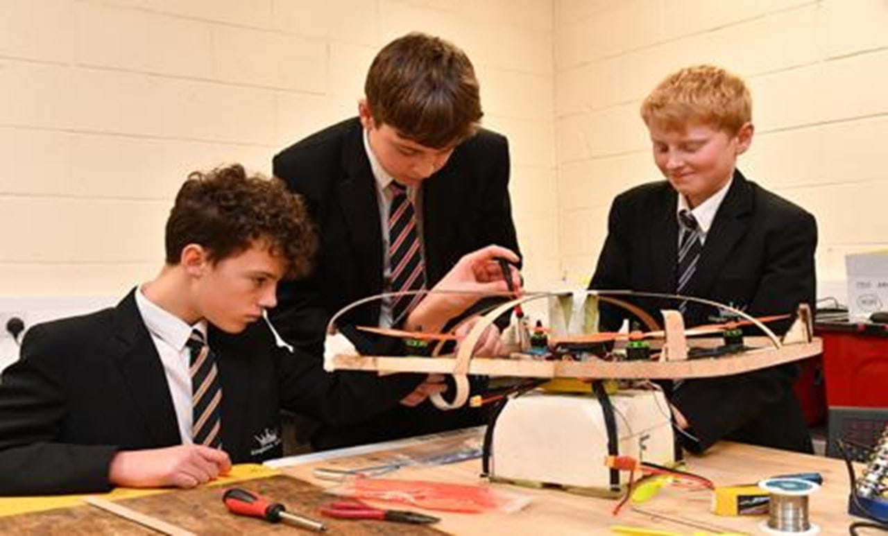 Pupils from the winning Kingdown School team modify their quadcopter
