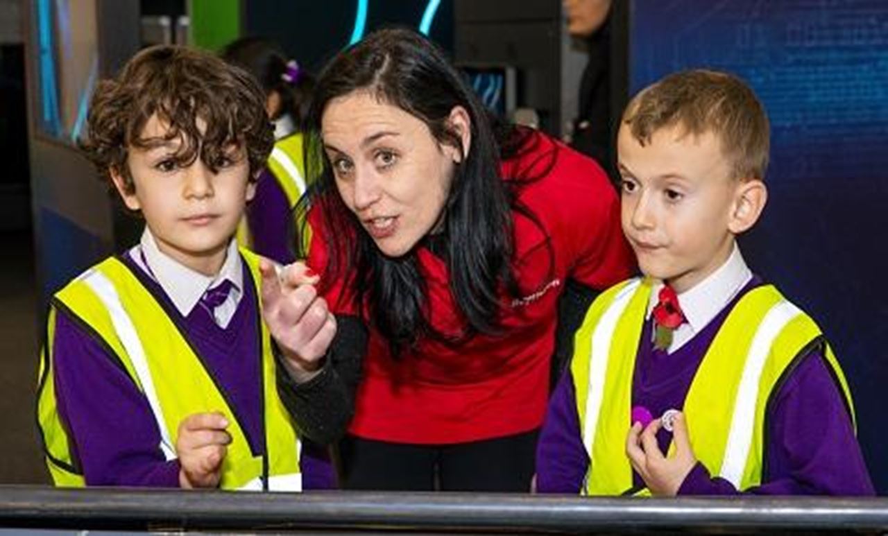 A Raytheon UK STEM Ambassador mentors schoolchildren during a MathsAlive! UK schools visit.