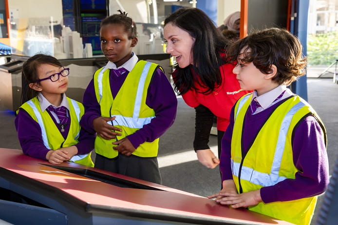 A Raytheon STEM Ambassador helps pupils engage with interactive exhibits  