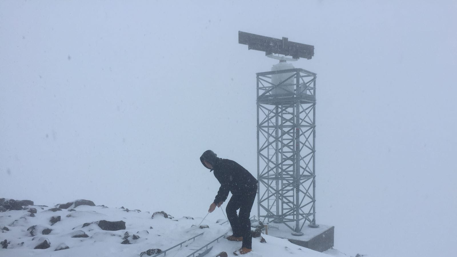 This engineer works on top of a Norwegian mountain to install the Condor MK3 next-gen radar.
