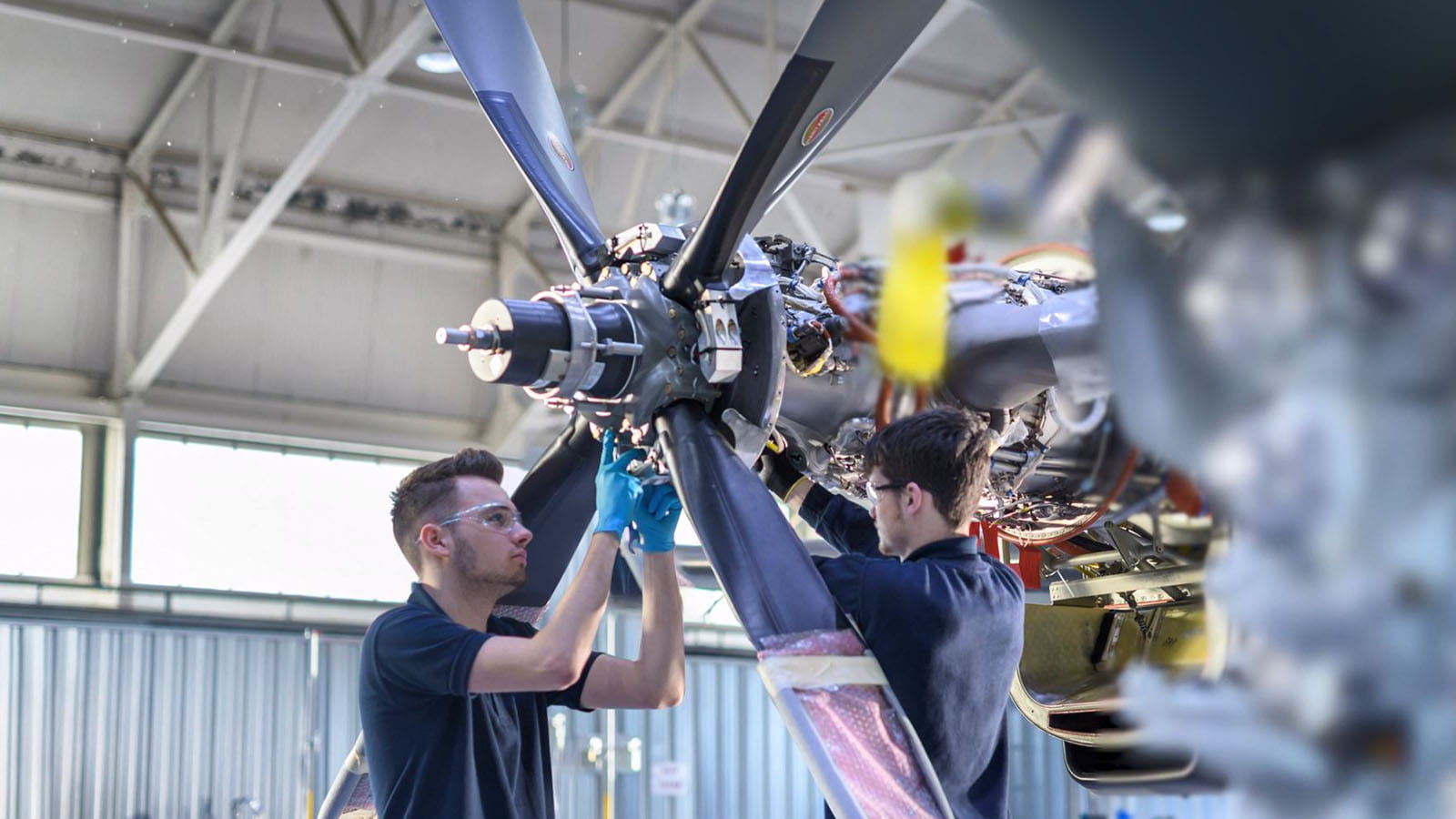employees working on a propeller