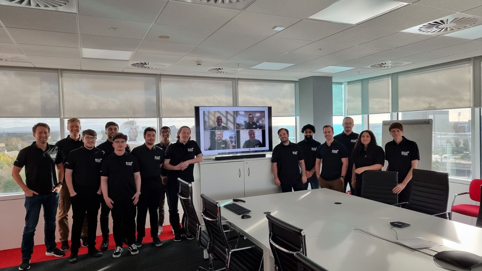 First RISE Academy cohort standing in a group