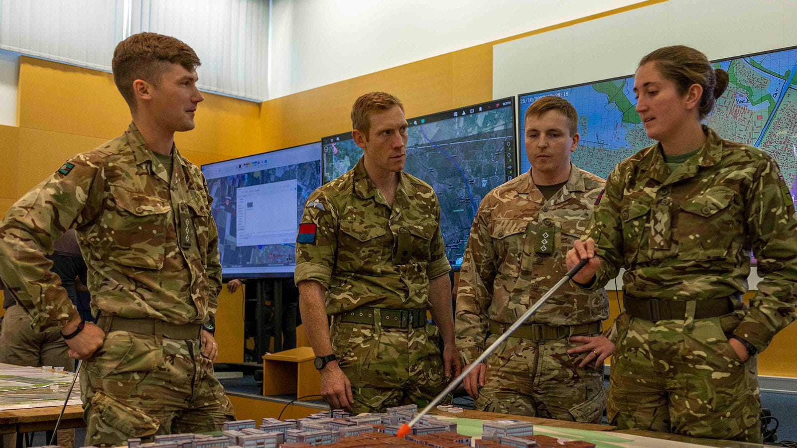 Soldiers discussing mission strategy at Exercise Cerberus