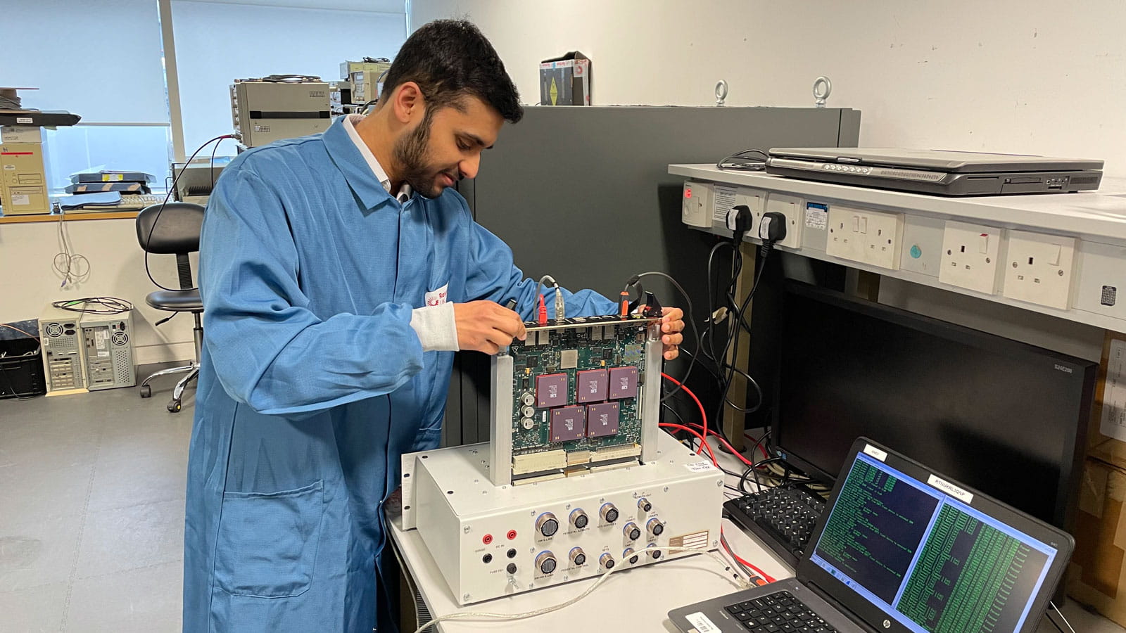 Chinmay tests a professor board for the Condor MK3 radar system on a test rig.   