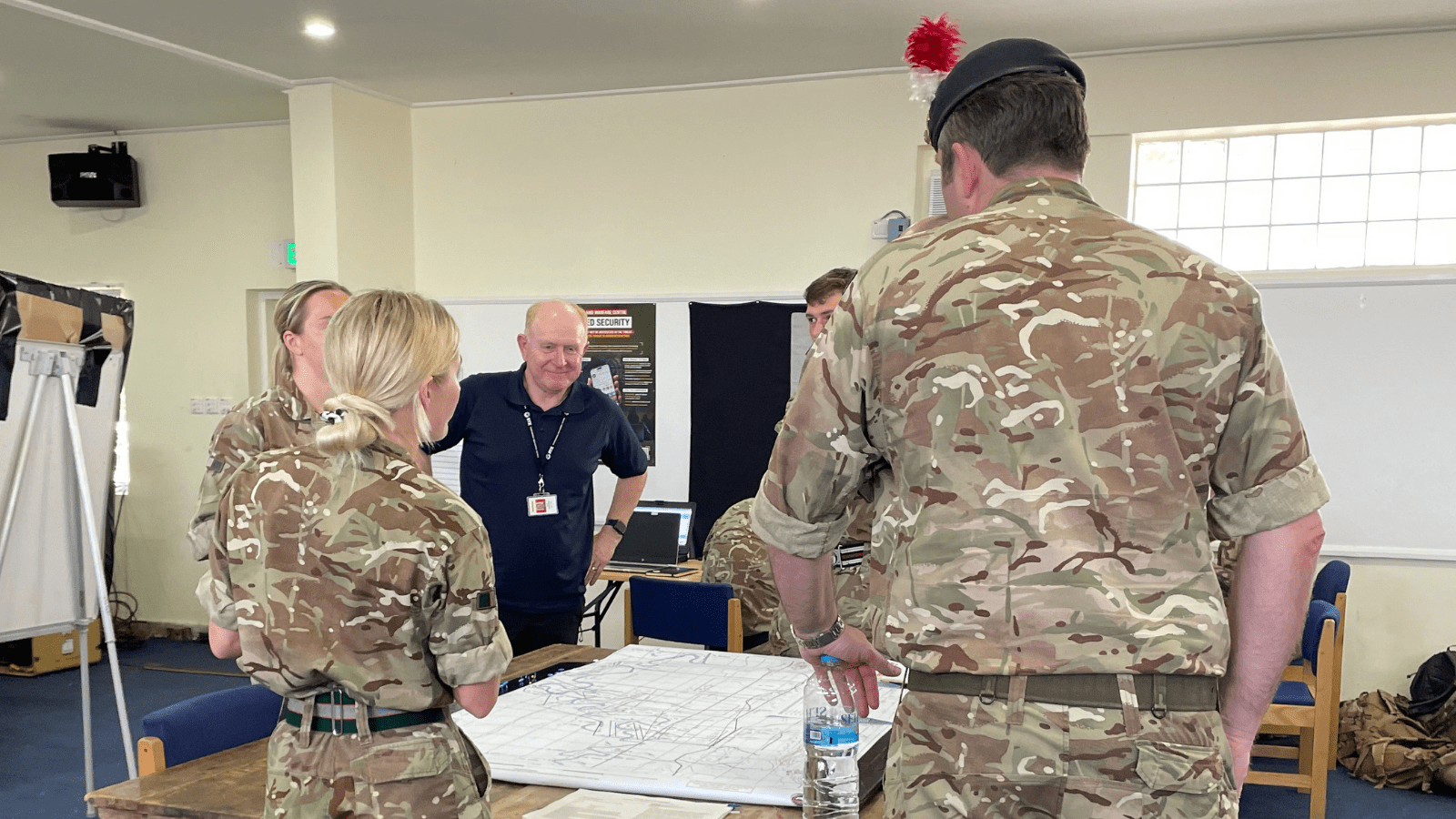 A group of soldiers studying a map